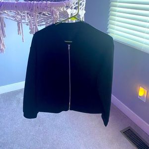 This is a black zip up jacket.